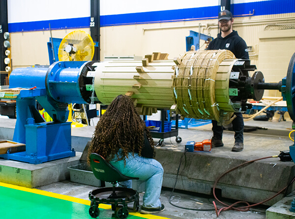 Dedicated coil nesting area for precise sizing, stacking, and alignment of HV and LV coils