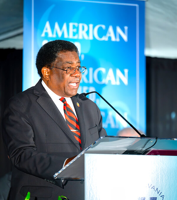 State Rep. Garland Pierce speaks from the podium during the groundbreaking event